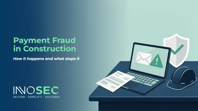 Illustration of a laptop showing an email warning beside an invoice and a hard hat
